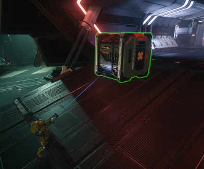 A player uses a handheld tractor beam to load cargo into a ship.