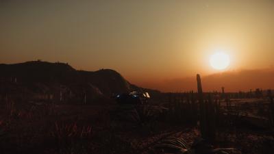 A small spaceship parked on a barren red plain covered with cacti and scrub brush. Its rear loading ramp is extended. A setting sun hangs in the sky.